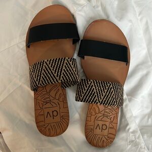 Women’s Slip on Sandals with Black & Tan straps.